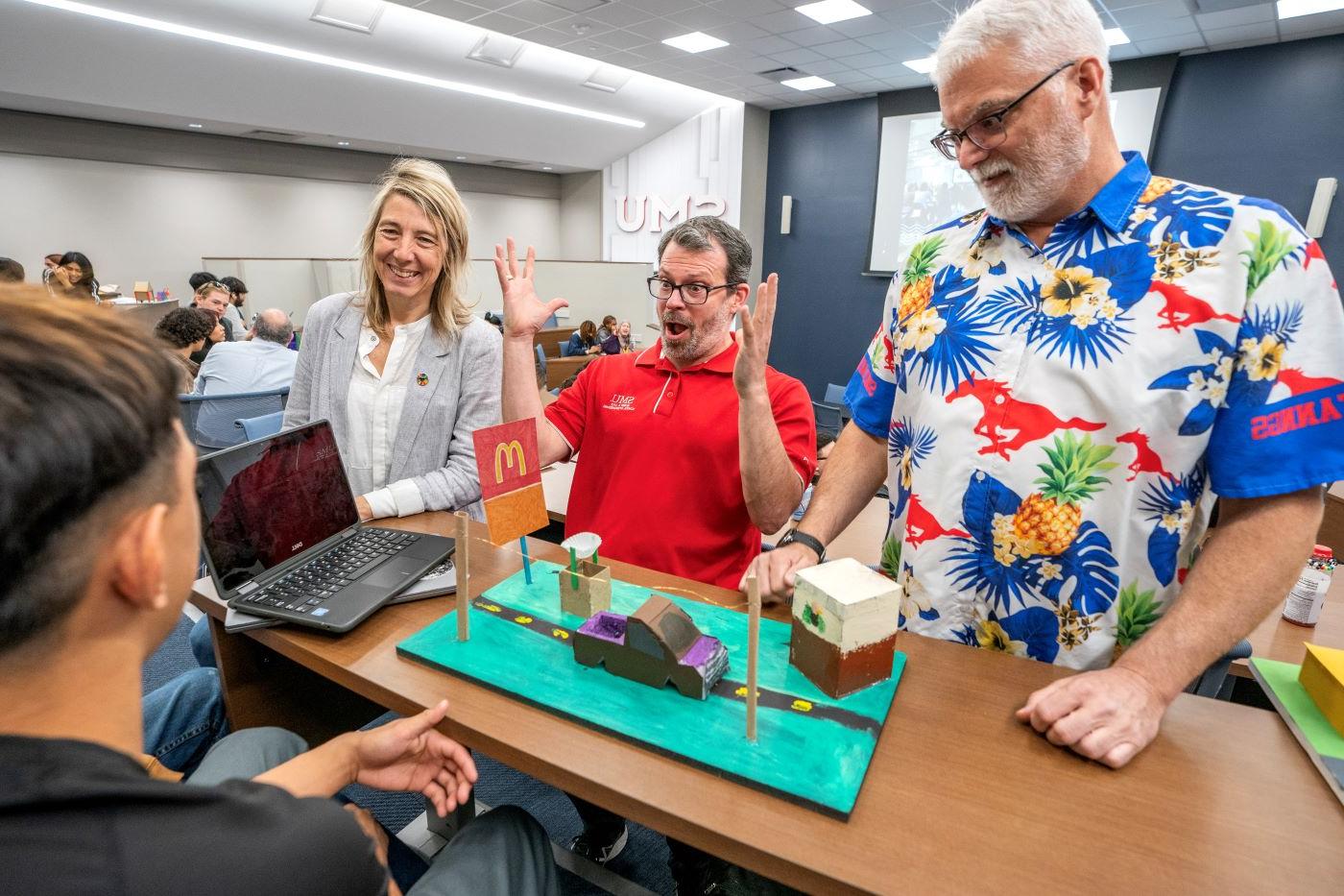 Professors interacting during special event